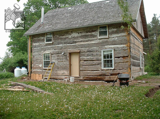 Rotted sill beam in log house
