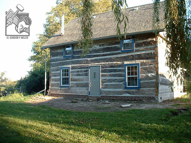 Restored windows, door, and sill beam replaced with masonry